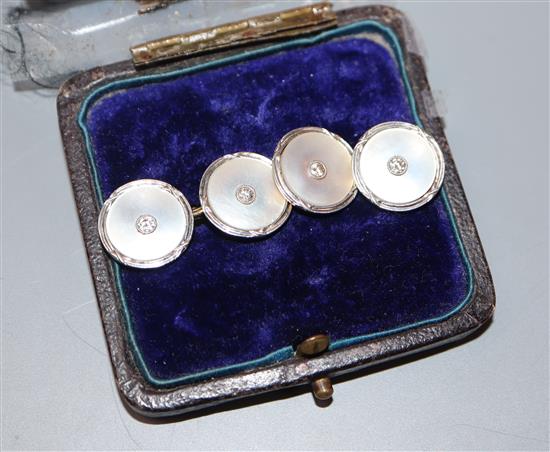 A pair of early to mid 20th century 18ct and plat, mother of pearl and diamond set cufflinks.